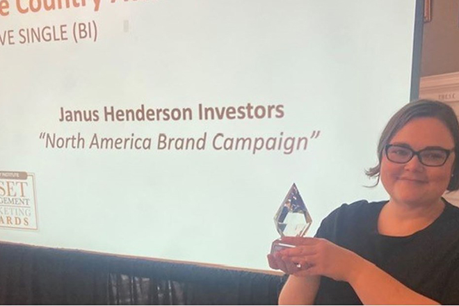 na-brand-win-julia JHI winner holding award for North America brand campaign